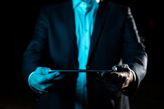 Businessman Holding Tablet With Both Hands And Presenting Important Data