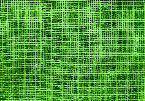 An abstract background of rough green fabric. ..Background of wire. Background for design with copy space.