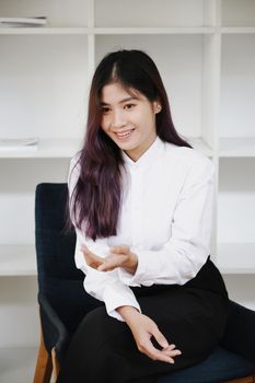 woman sitting on chair talking to partner