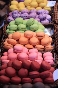 Macarons in different colors and flavors on a a market