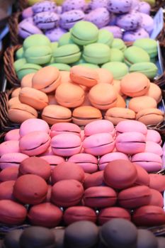 Macarons in different colors and flavors on a a market