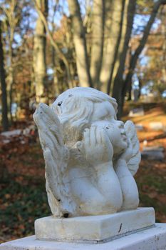 a Guardian angel grave ornament on a cemetery