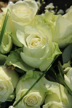 Big ivory white roses in a floral wedding arrangement