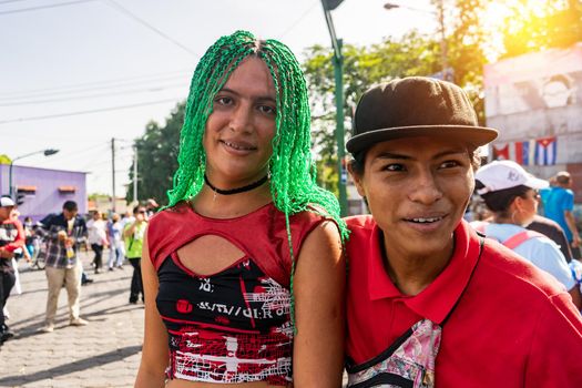 Latino transgender couple outdoors participating in a traditional festival in Managua, Nicaragua