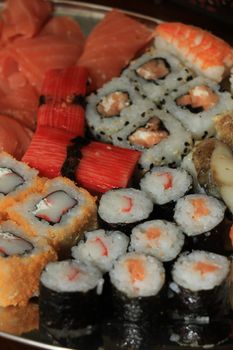 Japanese sushi and sashimi, various sorts on a serving plate