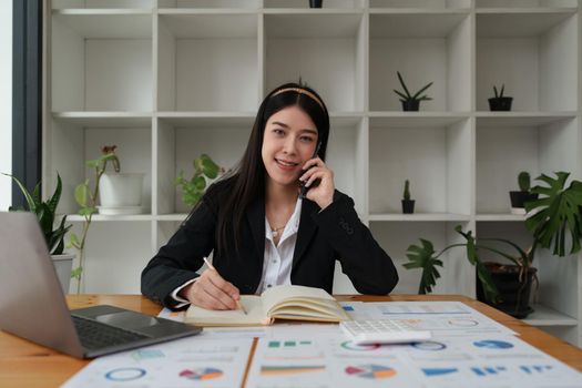 Portrait of Business woman or accountant or banker audit and analysis with financial costs wisely and carefully, investment and saving concept