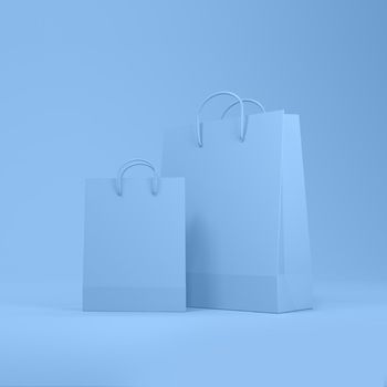 Shopping bags in blue background with space for text or design. 3d rendering.