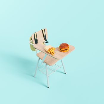 3D illustration of french fries and burger placed on school desk during break in studies against turquoise background