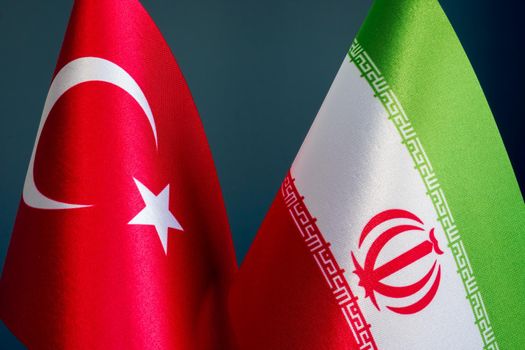 Small flags of Turkey and Iran as concept of diplomacy.