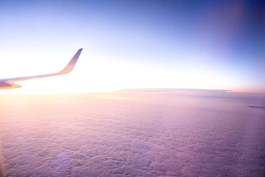 View from the plane on a beautiful orange sunset