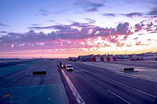 beautiful sunset at los angeles airport terminal and tarmac