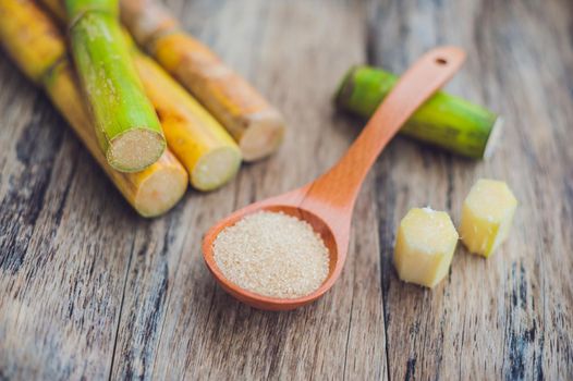 Granulated brown sugar produced from sugar cane, top view. Agriculture Industry concept.