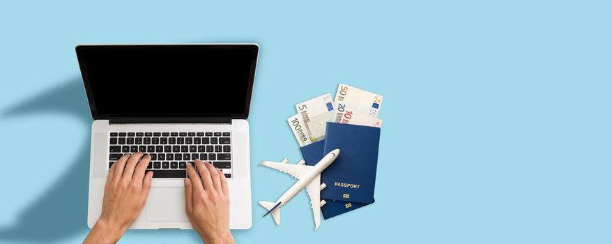 image of passport book and laptop computer.Trip and Travel insurance concept. High quality photo