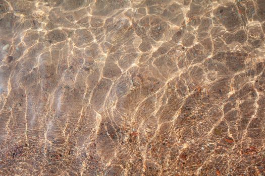 Seascape of clear water on the sea. Clear water on the ocean, sea or lake. Water ripples in the sun.