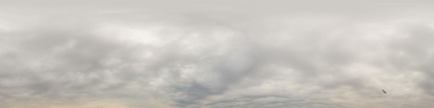 Sky panorama on overcast rainy day with low clouds in seamless spherical equirectangular format. Complete zenith for use in 3D graphics, game and for aerial drone 360 degree panorama as a sky dome.