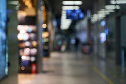 Blurred international airport interior background with bokeh and copy space