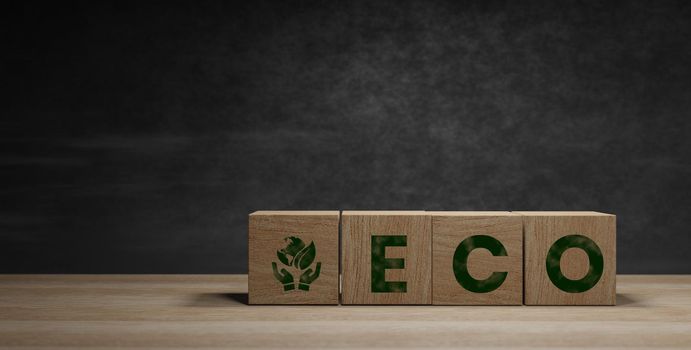 wooden blocks with the ecology symbol dark background and copy space ,world earth day and world environment day