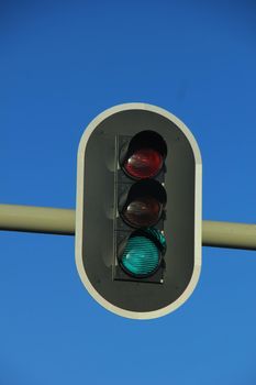 Traffic lights in a clear blue sky