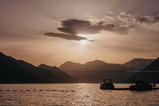 Silhouette of sailing yachts in the sea on beautiful sunset backgroung