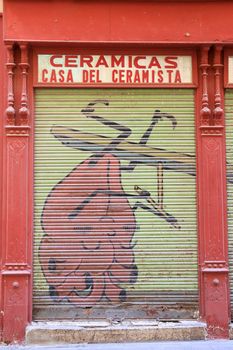 Cartagena, Murcia, Spain- July 18, 2022: Old ceramic business closed to the public due to the crisis