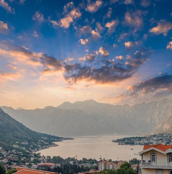 Sunset, beautiful landscape with silhouettes of trees. Travel concept. Montenegro, Kotor Bay. Sunset at Kotor Bay Montenegro. View of the sunset in Boko-Kotor Bay in Montenegro.