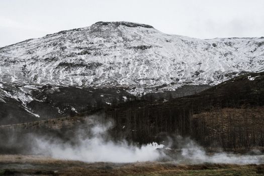 Icelands snowy mountain and blue sky. Shooting Location: Iceland, Lay Cavik