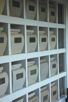 Urns with ashes in a columbarium wall