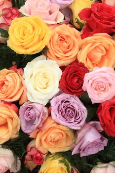 Multicolored roses in a floral wedding decoration