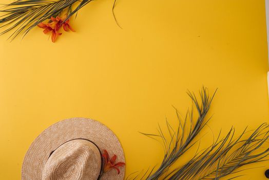 ummer background with straw hat and bag and palm leaves. High quality photo