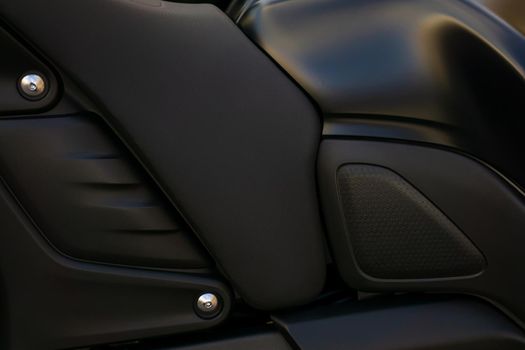 Stylish black background motorcycle detail close up