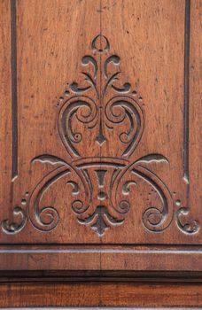 Cartagena, Murcia, Spain- July 18, 2022: Beautiful carved details on vintage wooden door in Cartagena