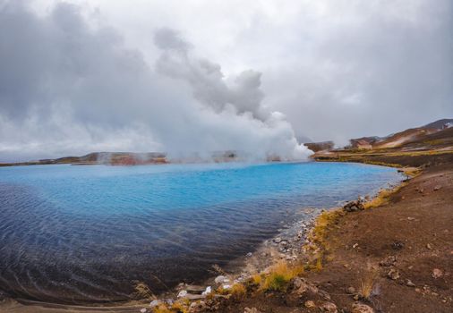 Blue lake near geothermal power plants