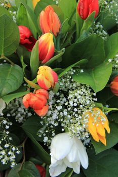 yellow, white and red tulips in a spring bouquet