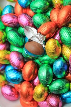 a group of foil wrapped chocolate easter eggs