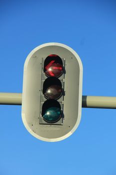 Traffic lights in a clear blue sky