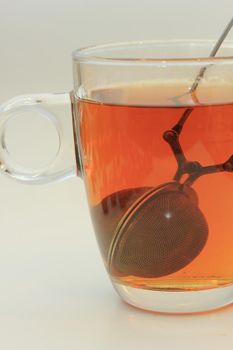 Metal tea infuser with tea dripping out