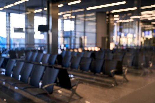 Blurred international airport interior background with bokeh and copy space