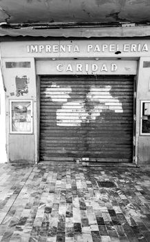 Cartagena, Murcia, Spain- July 18, 2022: Old printing shop business closed to the public due to the crisis