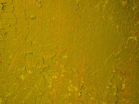 Surface of old peeling damaged orange paint.