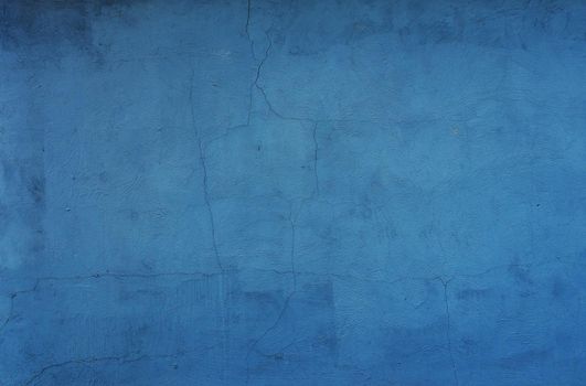 Old blue grungy backdrop with textures. place for text.