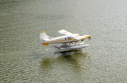 Juneau, AK - 9 June 2022: Wings Air seaplane taking off in the harbor of Juneau
