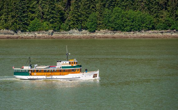 Juneau, AK - 9 June 2022: View of the the MV Discovery historic yacht cruising from Juneau