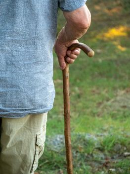 close up of wrinkled male old man on a sky pole
