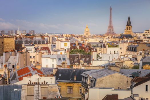 Eiffel tower and parisian roofs at sunrise Paris, France