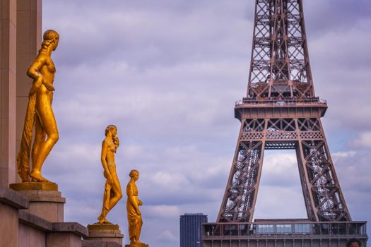 Eiffel tower from Trocadero with golden statues line, Paris, France