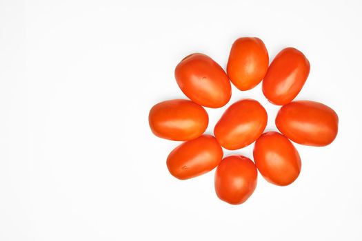 a glossy red, or occasionally yellow, pulpy edible fruit that is eaten as a vegetable or in salad. Juicy ripe tomatoes isolated on the white background, space for notes . High quality photo