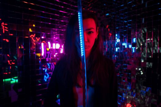 Male transgender neon light studio. Asian with samurai sword