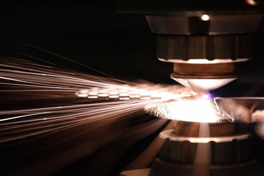 Laser cutting of metal sheet closeup. CNC Laser cutting of metal using modern industrial technologies