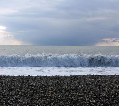 Storm at sea, storm warning on the coast. Big sea waves during a storm