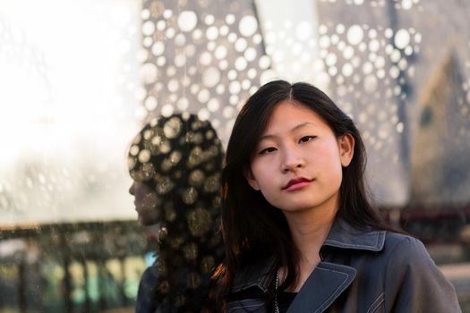 portrait of a young beautiful chinese woman looking at camera, copy space for text